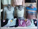 several mannequins are on display in a clothing store