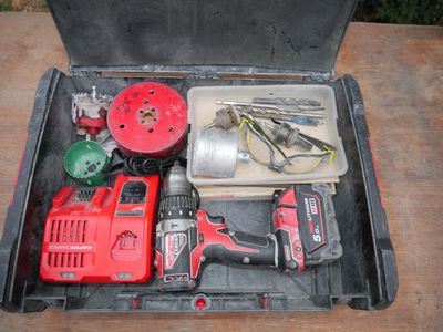 a tool box with tools in it sitting on a table