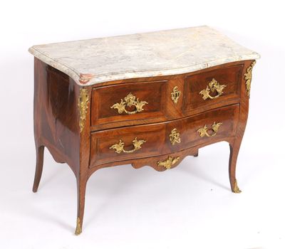 an antique chest of drawers with marble top and brass handles