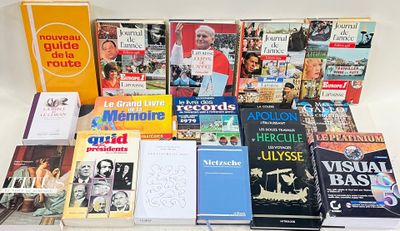 a lot of books that are sitting on a table