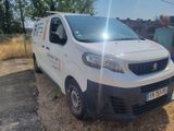 a white van that is parked on the side of the road