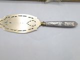 a silver spoon and a knife on a table