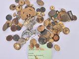 a pile of old buttons and buttons on a white surface