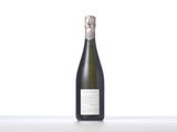 the bottle of champagne is sitting on the table