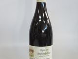 a bottle of wine that is sitting on a table