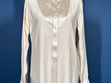 a woman ' s shirt on a mannequin mannequin mannequin mannequin mannequin mannequin mannequin mannequin mann