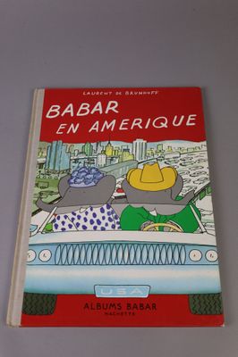 a book with a picture of two elephants in a car