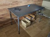 a table that has a bunch of boxes on it