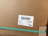 a cardboard box with a sticker on it sitting on the floor