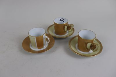 three coffee cups and saucers are sitting on a table