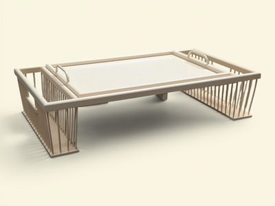 une table basse avec un plateau en verre posée sur un piètement blanc