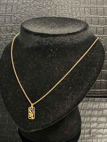 Chaine de cou et pendentif à décor de fleurette sertie de pierre ...