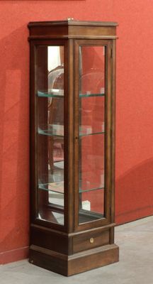 a wooden display case with glass doors on the side of a building
