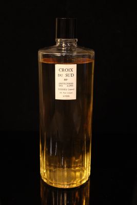 an image of a bottle of cologne sitting on top of a table
