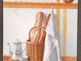une photo d'un tableau représentant du pain dans un panier posé sur une étagère
