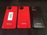 three red and black cell phones sitting next to each other on a table