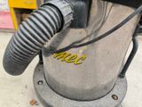 a machine that has a hose attached to the side of it