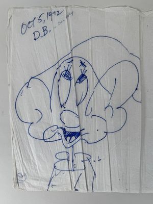 drawing of a cartoon character on a piece of paper with writing on it