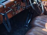 a brown leather seat in the back of an old car