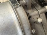 a close up of a motorcycle engine with a chain attached to it