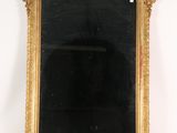 a mirror that is sitting on top of a mantle