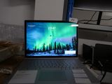 a laptop computer sitting on top of a desk