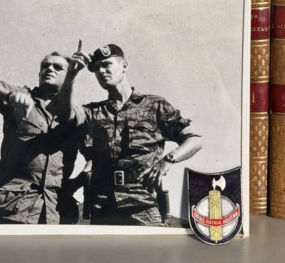 a picture of two men in military uniforms standing next to each other