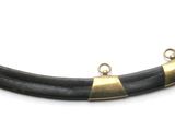a very long horn with a metal handle on it