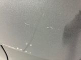 a close up of a piece of glass on the side of a refrigerator
