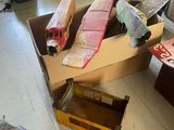 a pile of boxes and a box with a toy airplane in it