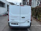 a white van that is parked in a parking lot