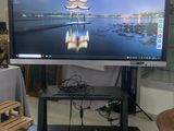 a flat screen tv sitting on a stand in a living room