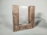 a picture of a picture frame made of wood and glass
