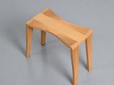 a small wooden bench that is on the floor