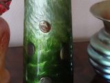 three vases sitting on a table next to each other