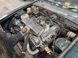 a small engine in the trunk of an old car