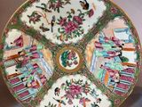 an image of a decorative plate with flowers and birds on it