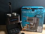 the coffee maker is sitting next to a box of coffee