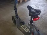 a scooter that is parked in a garage