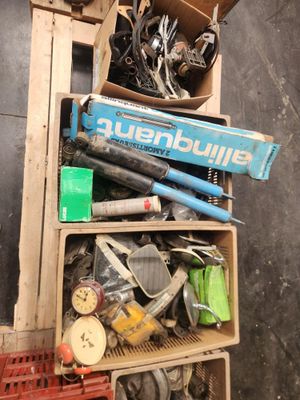 a pile of assorted items in a wooden crate