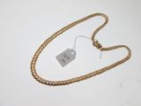 an image of a gold chain with a price tag on it