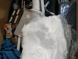 a cardboard box filled with items that include a toilet and other items