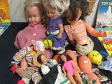 a lot of dolls that are sitting on a table