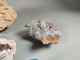 a rock with a piece of metal on top of it