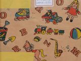 a small suitcase with a pattern of children ' s toys on it
