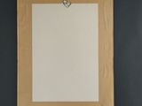 an empty piece of paper hanging on a black wall