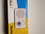 a white and blue box with a white radio on it