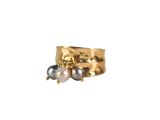 an image of a gold ring with two pearls on it