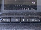 a close up of a car dashboard with a clock on it