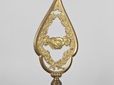 an image of a gold - plated clock on a stand